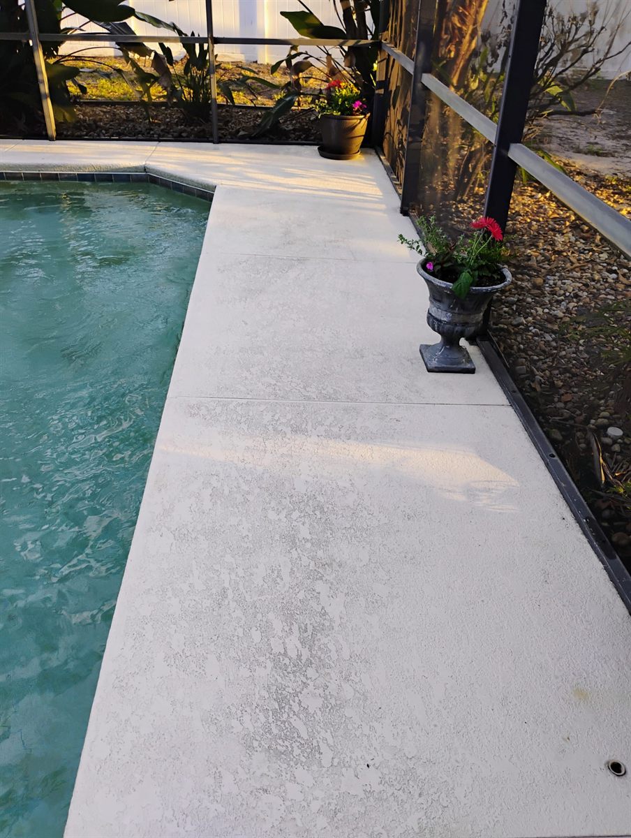 The same pool deck pressure-washed clean