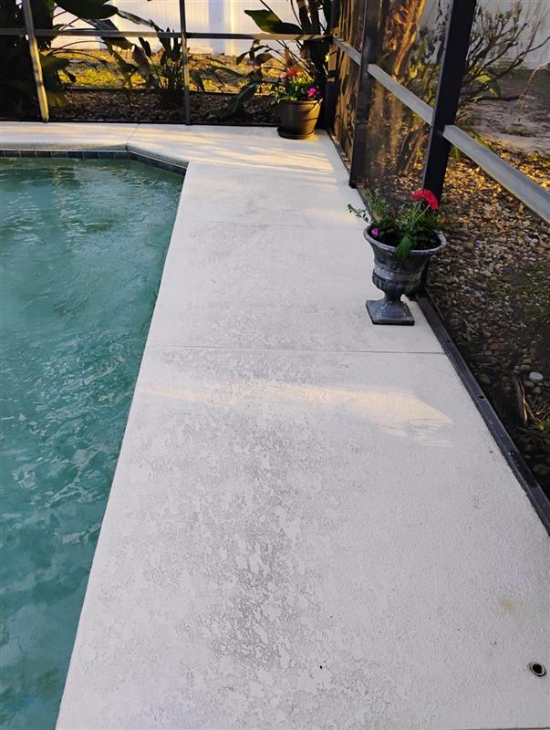 The same pool deck pressure-washed clean