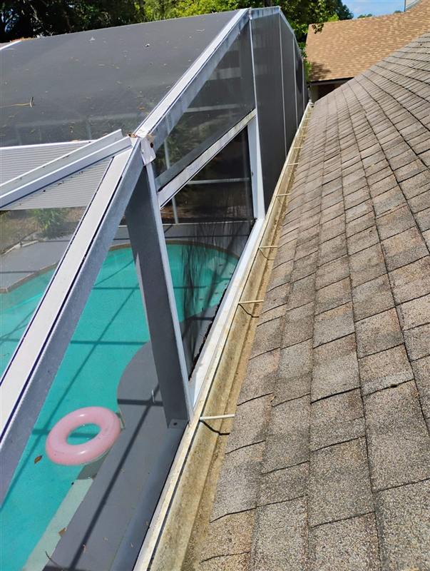The same gutter cleared out along the roofline